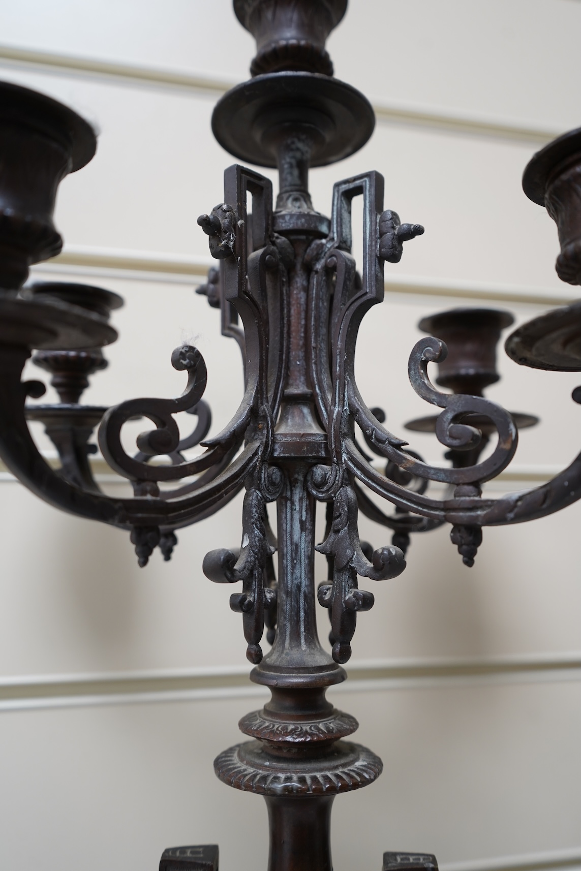A pair of early 20th century bronze and black slate five light, four branch candelabra, 60cm high